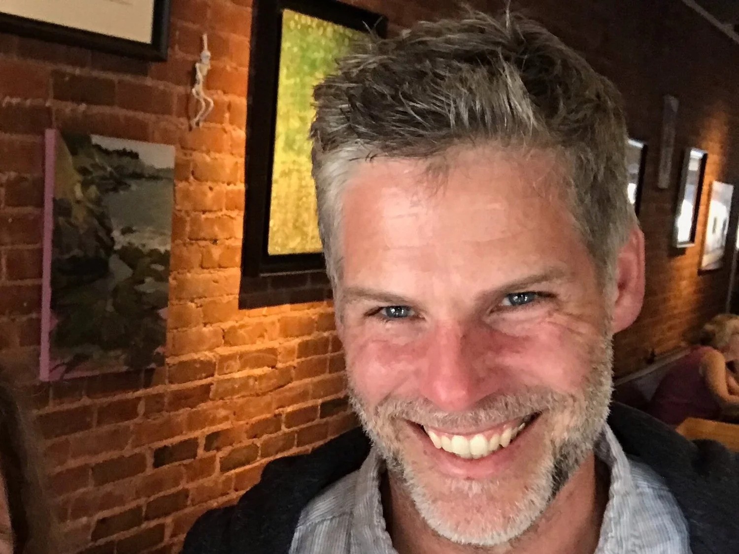 Jeb Gutelius smiling and posing for the camera